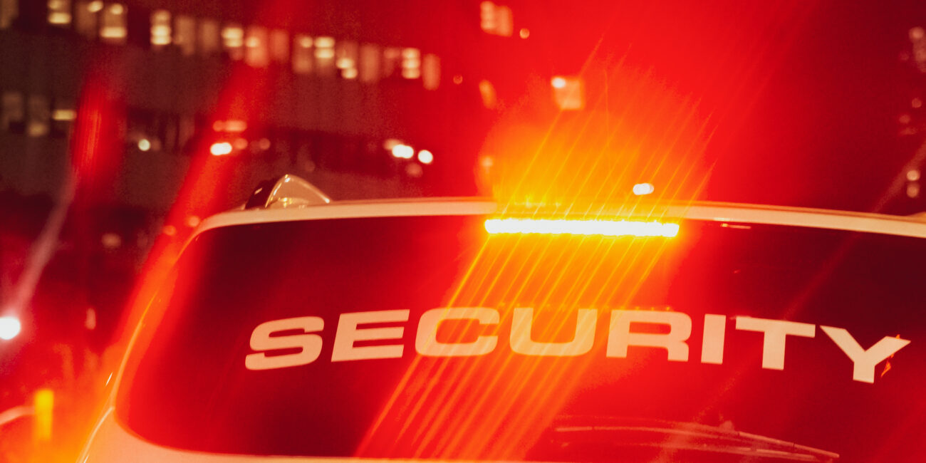 Security guard monitoring CCTV cameras in control room